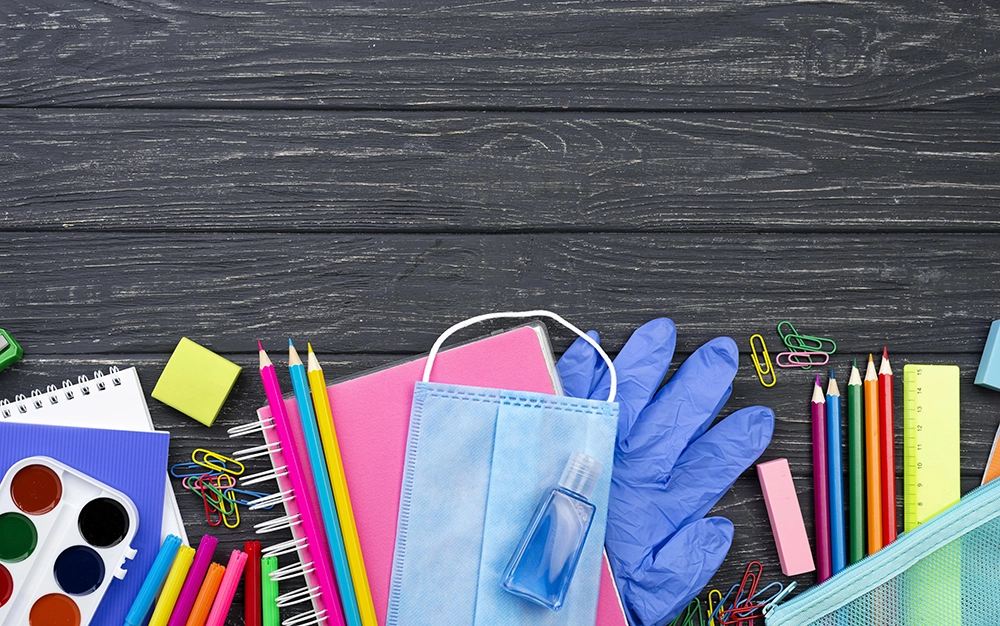 top view back school stationery with multicolored pencils medical mask